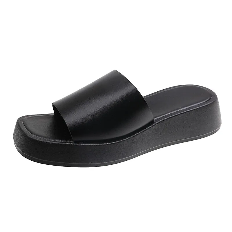 Minimalist slide sandals with a wide strap