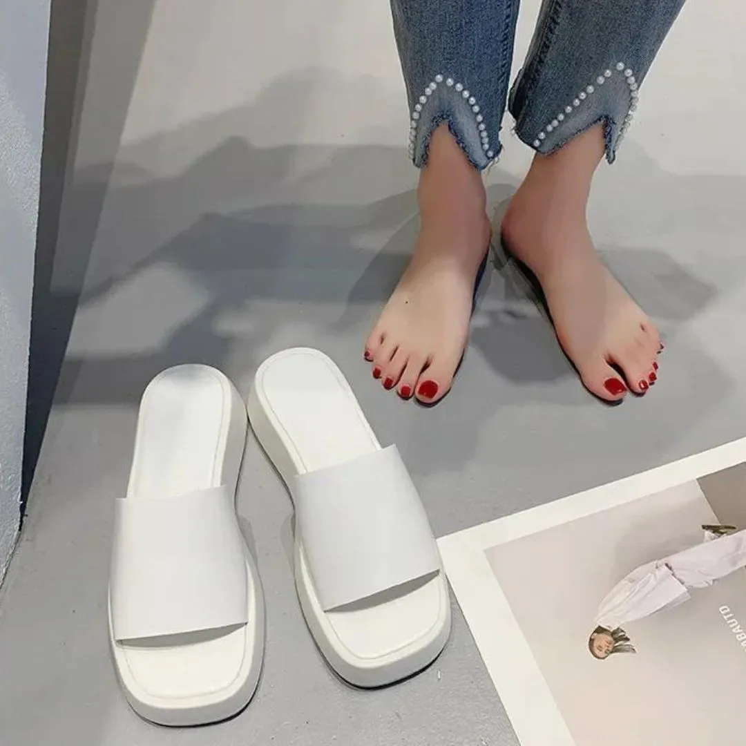 Minimalist slide sandals with a wide strap