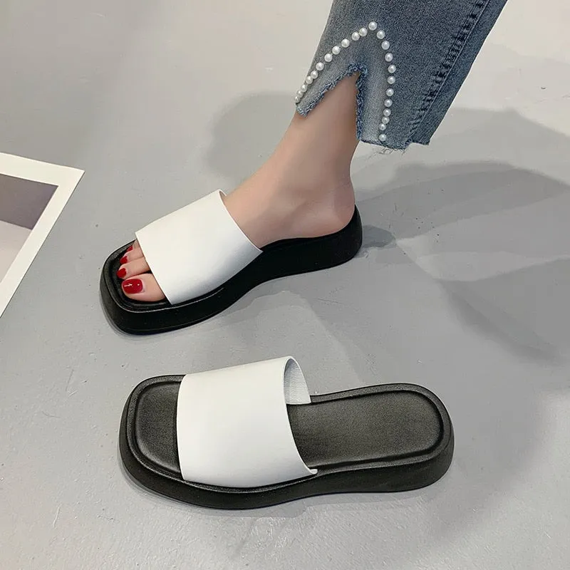 Minimalist slide sandals with a wide strap