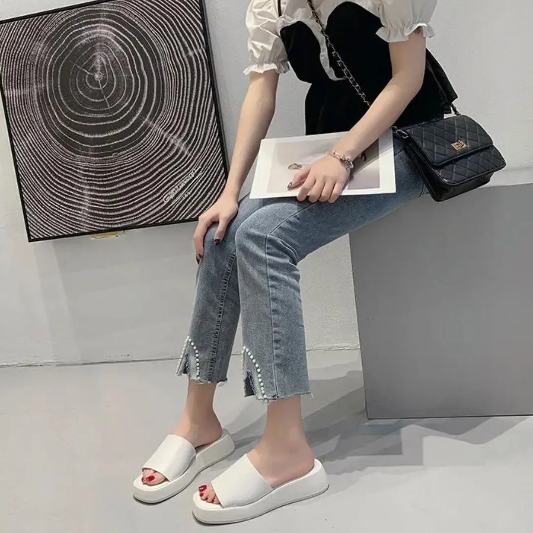 Minimalist slide sandals with a wide strap