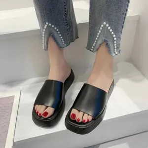 Minimalist slide sandals with a wide strap
