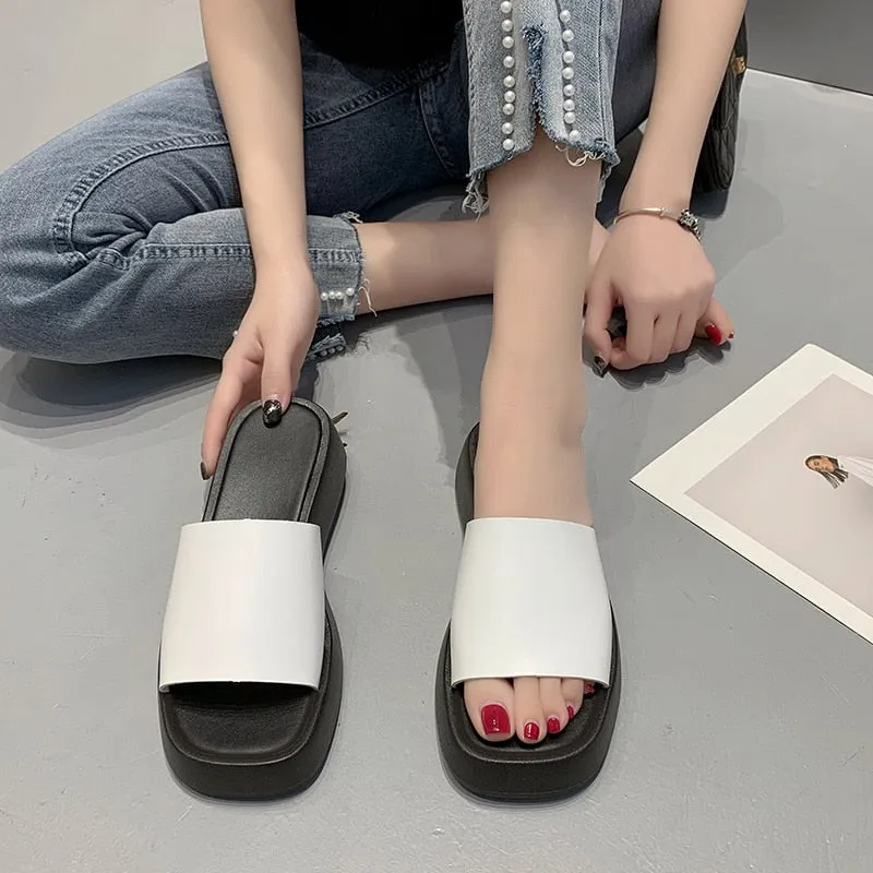 Minimalist slide sandals with a wide strap